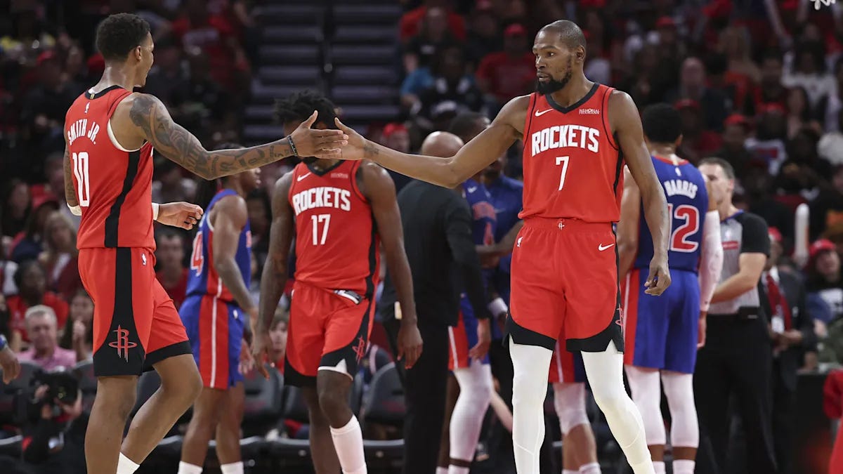 Kevin Durant and Jabari Smith Jr. in Houston Rockets uniforms on the court