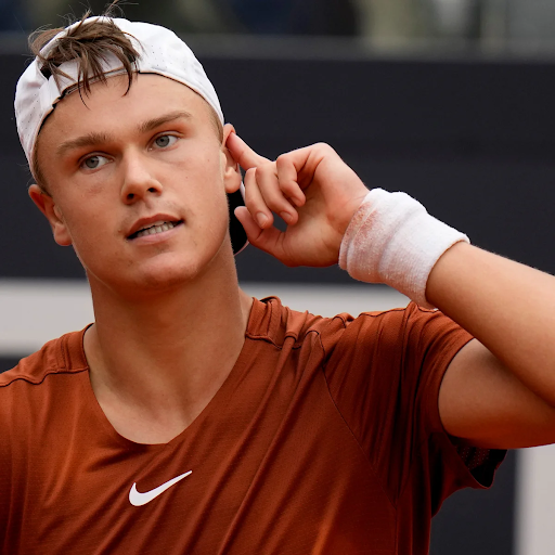 Holger Rune reacting during a tennis match
