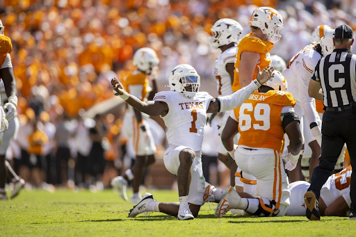Texas edge rusher Colin Simmons celebrating on the field against Tennessee